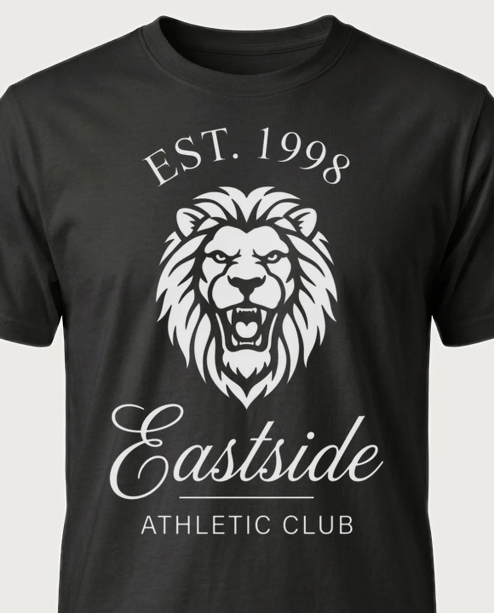 Eastside lion crest — Club Monogram on a black tee
