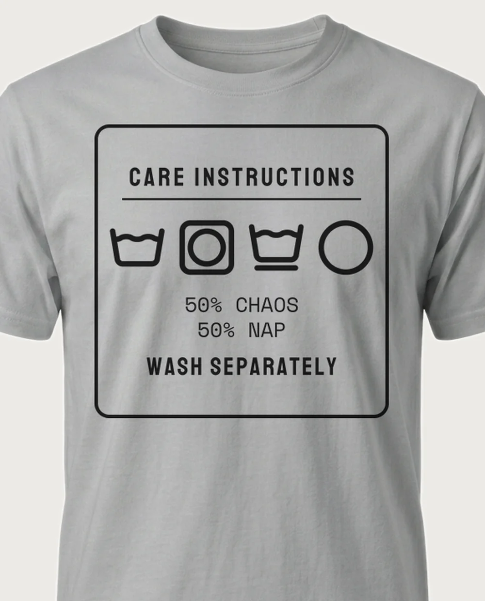 '50% CHAOS' — Care Label on a sport grey tee