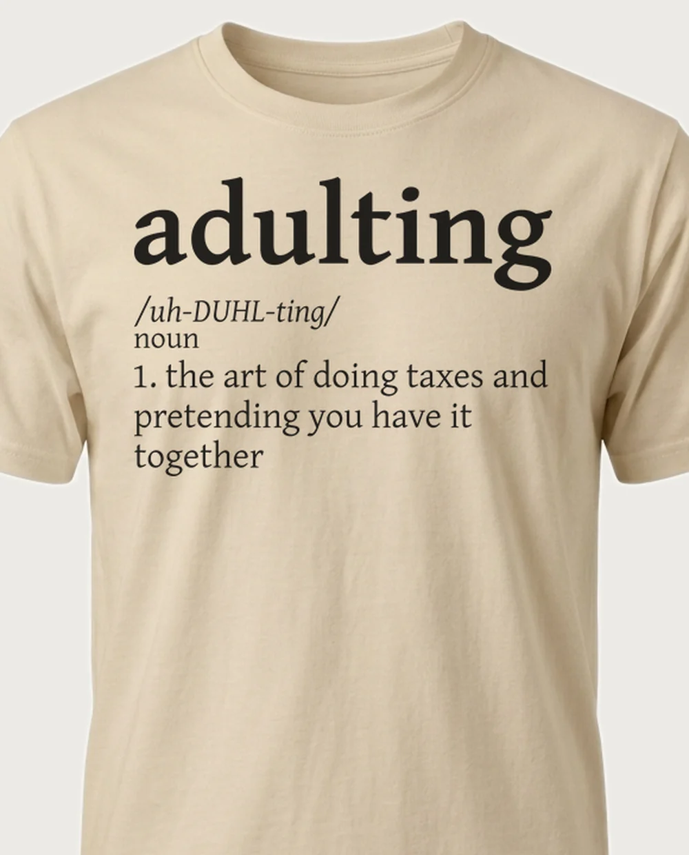 'ADULTING' — Dictionary on a sand tee