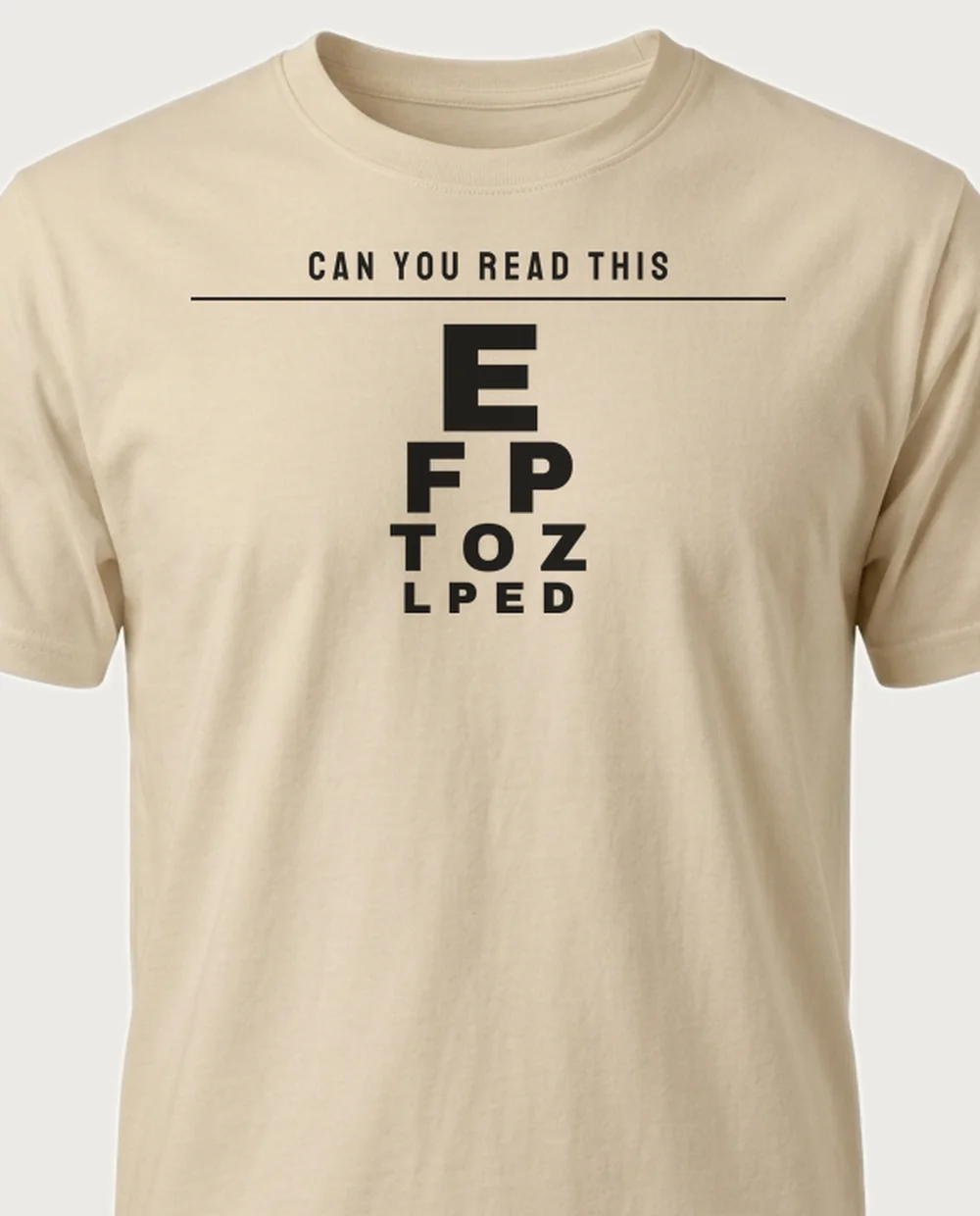 'CAN YOU READ THIS' — Eye Chart on a sand tee
