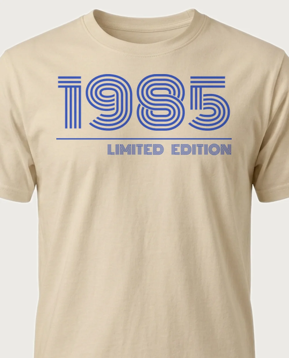 '1985' — Retro Year on a sand tee
