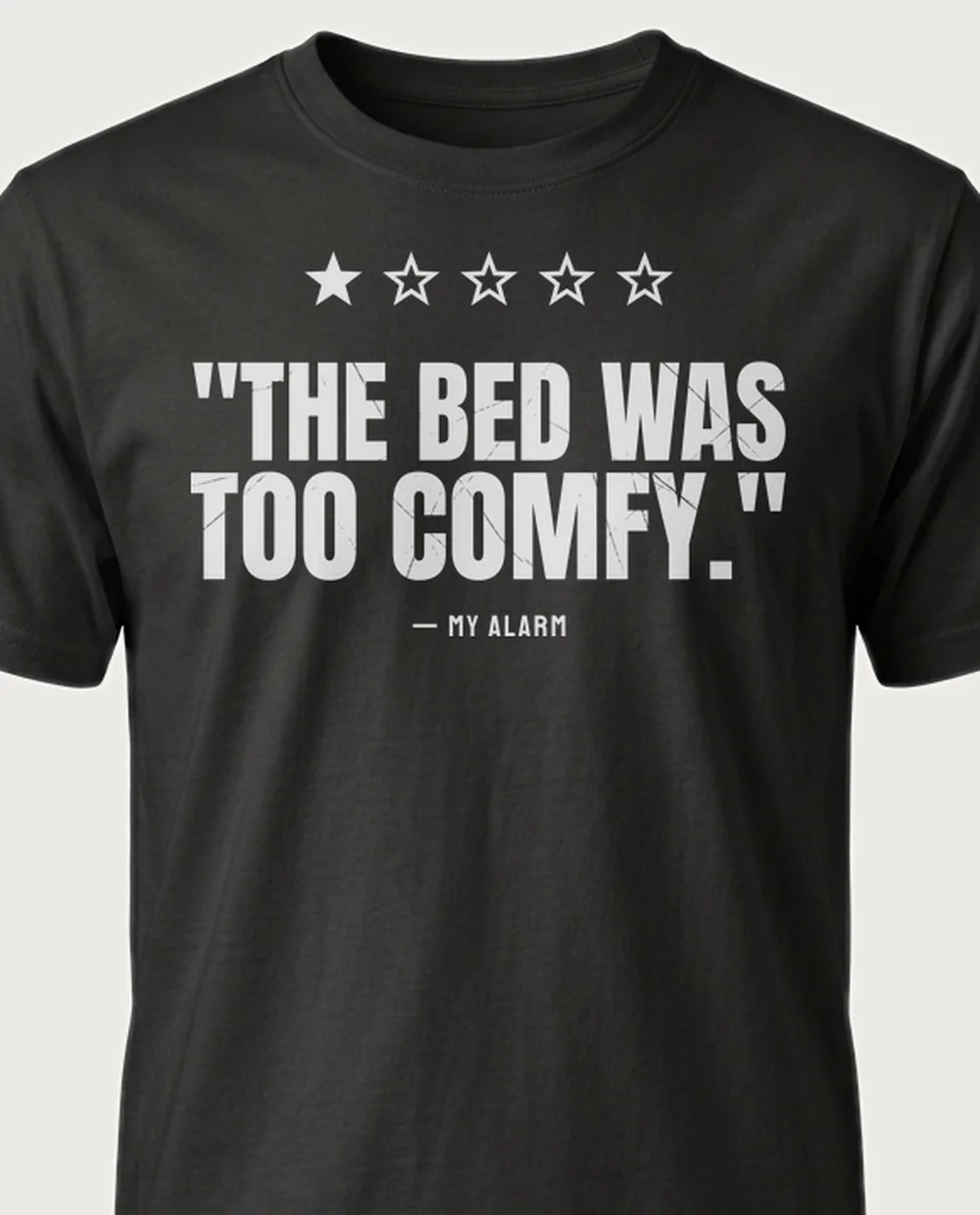 'bed too comfy' — One-Star Review on a black tee