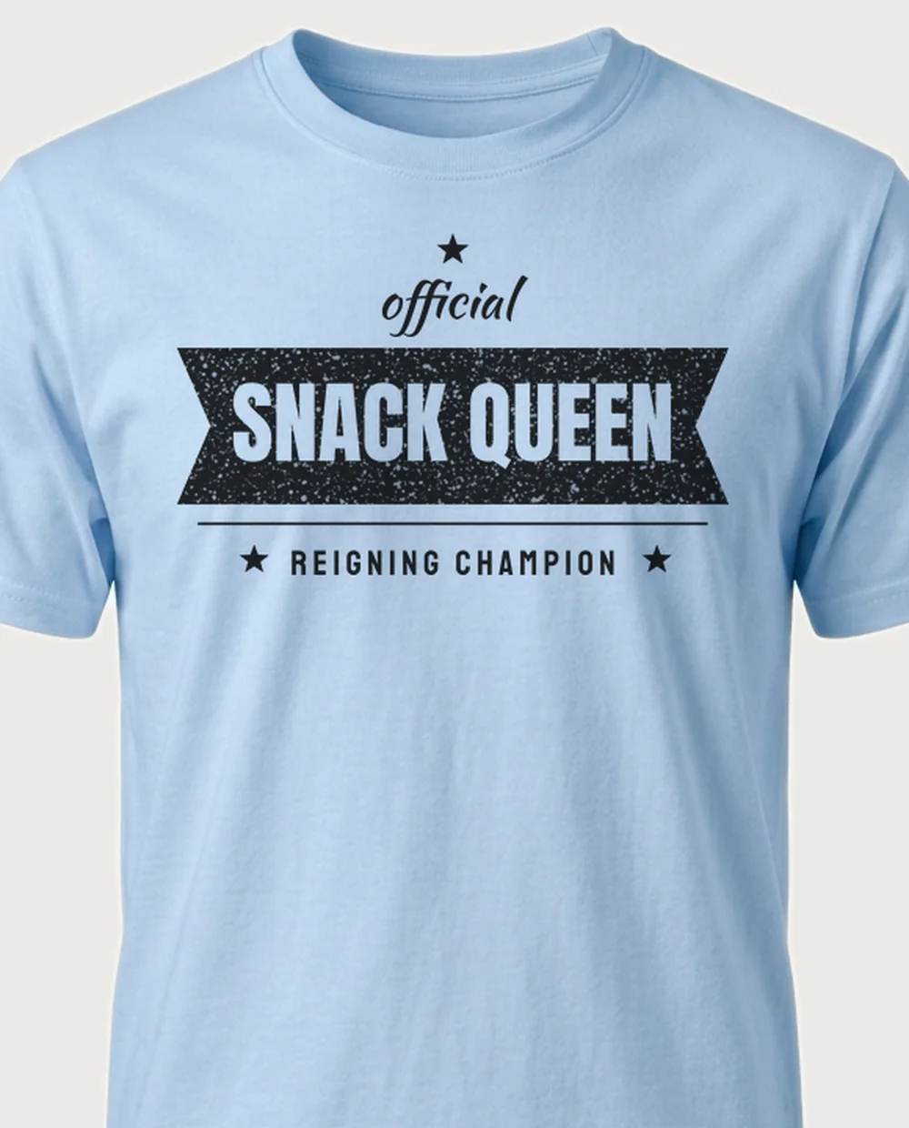 'SNACK QUEEN' — Ribbon Banner on a light blue tee