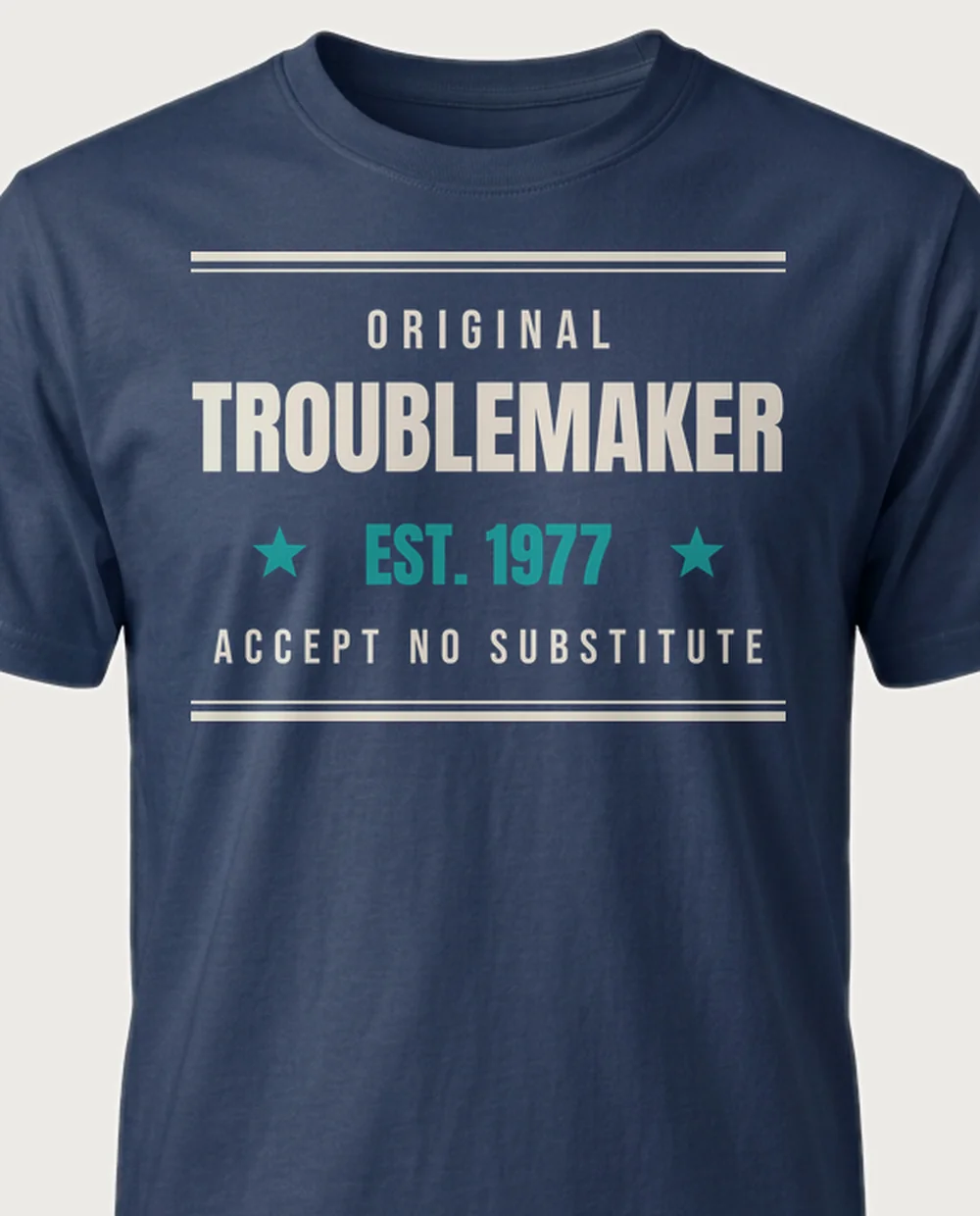 ORIGINAL TROUBLEMAKER — Established Since on a navy tee