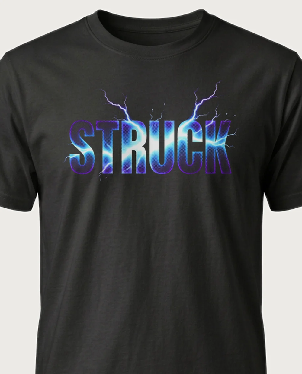 'STRUCK' — Halftone Lightning on a black tee