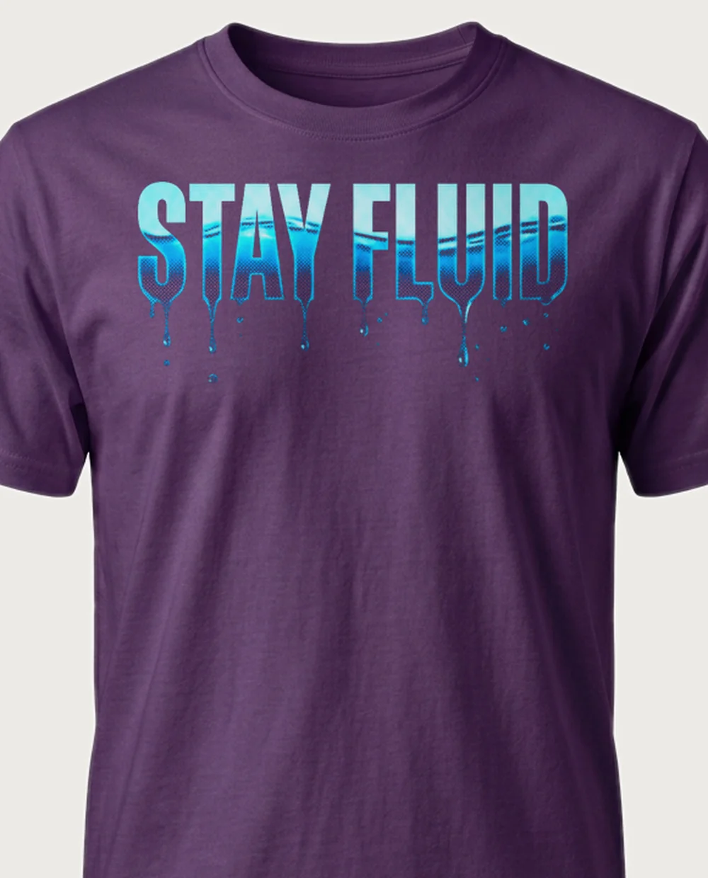 'STAY FLUID' — Halftone Water on a purple tee