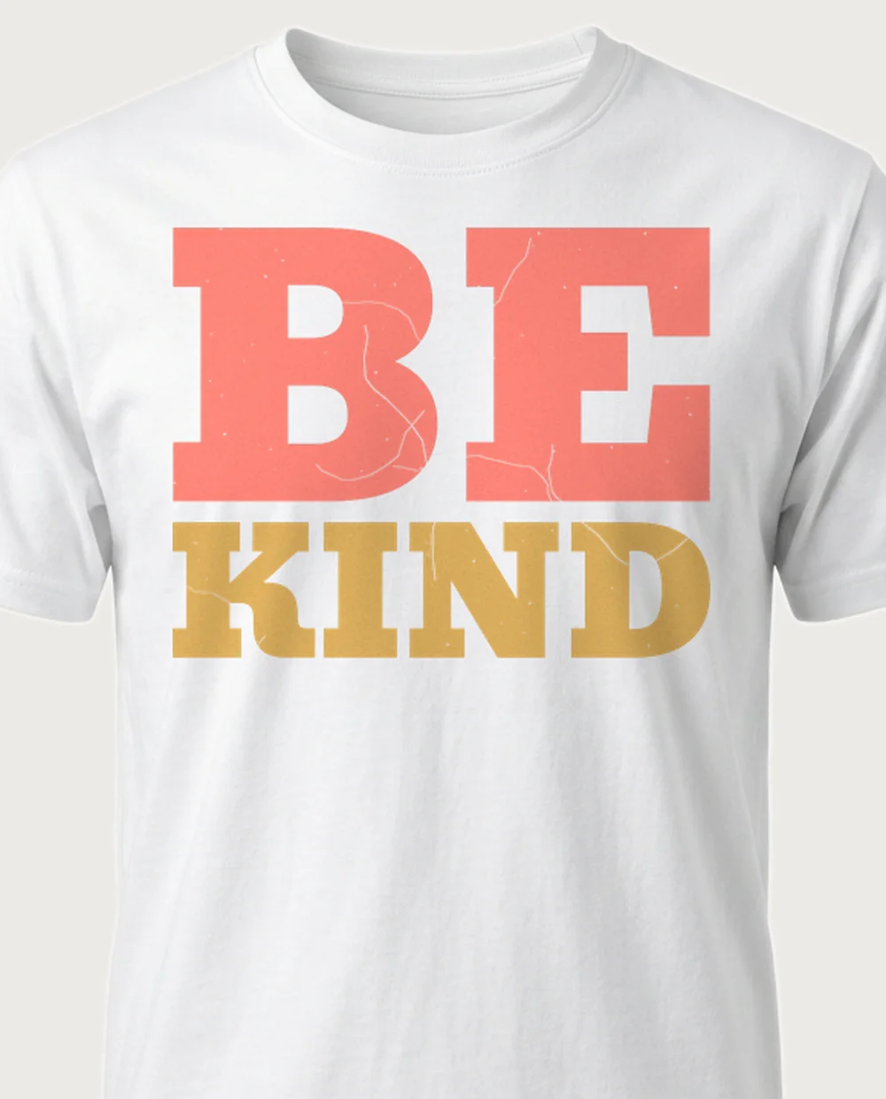 'BE KIND' — Rainbow Mantra on a white tee