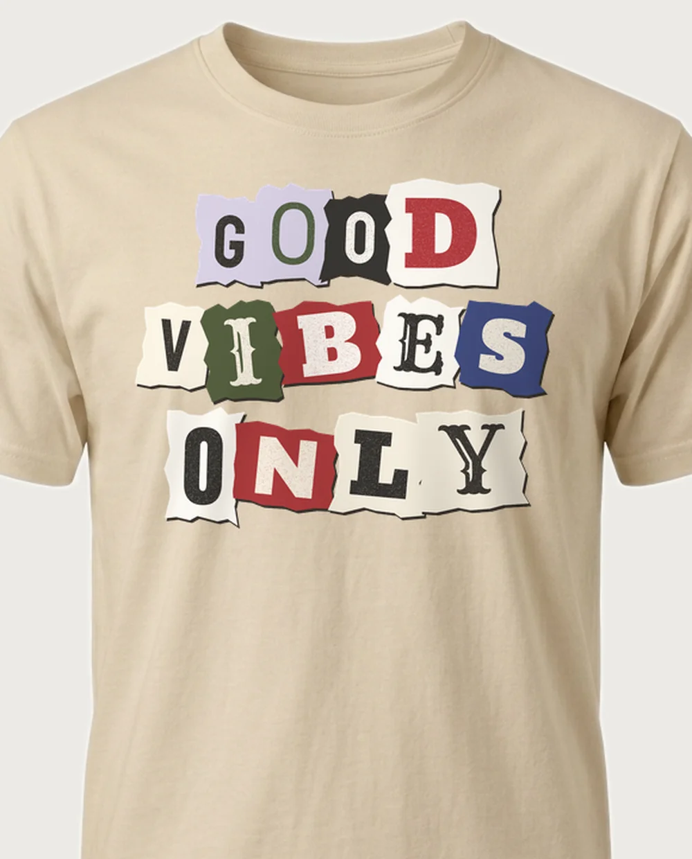 'GOOD VIBES ONLY' — Ransom Note on a sand tee
